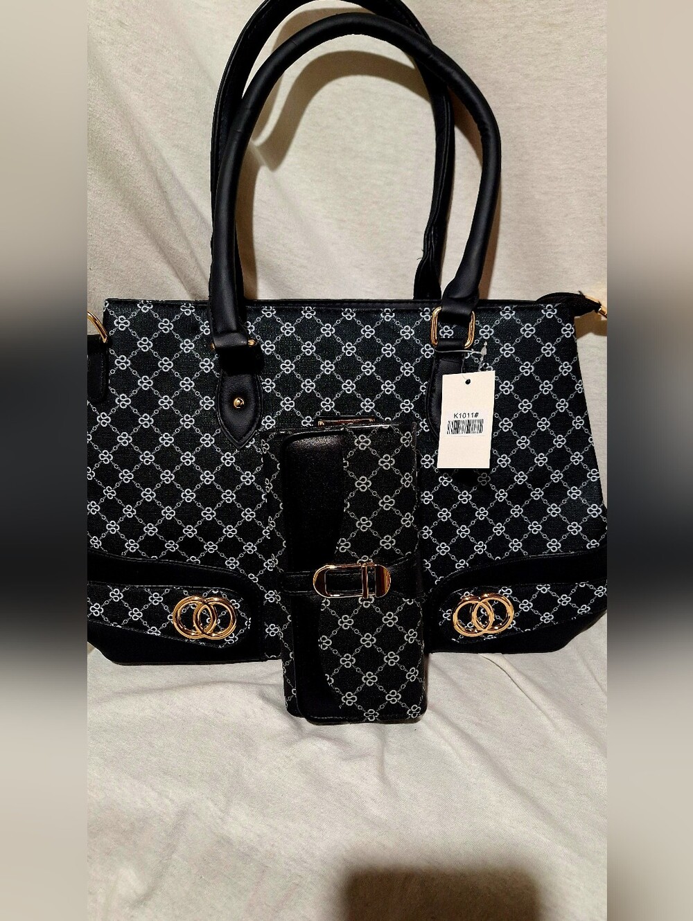 Stylish Black Patterned Tote Bag with Gold Accents